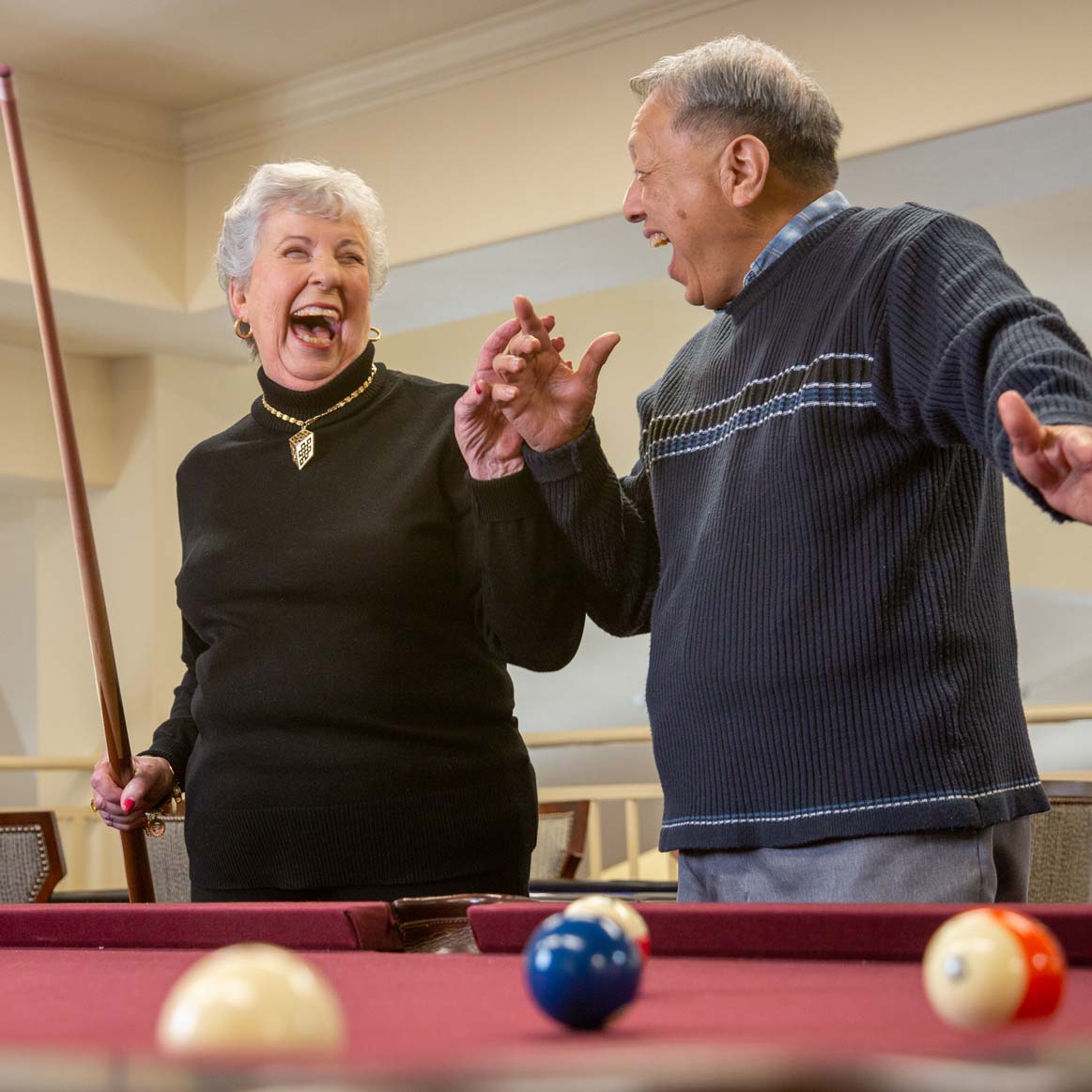 Residents playing billiards at Parker Place